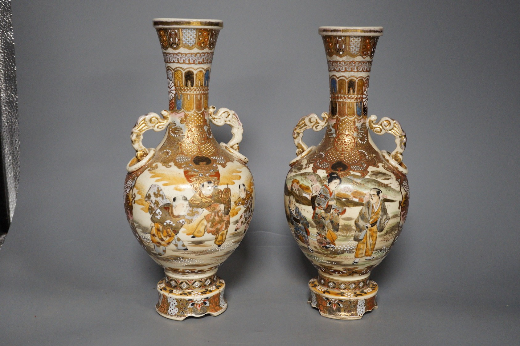 A pair of Japanese satsuma pottery vases, 30.5 cm high